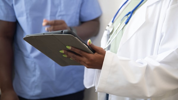 Doctor and patient during clinical consultation