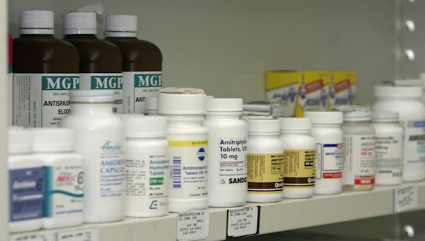 Pharmacy shelves stocked with medicines